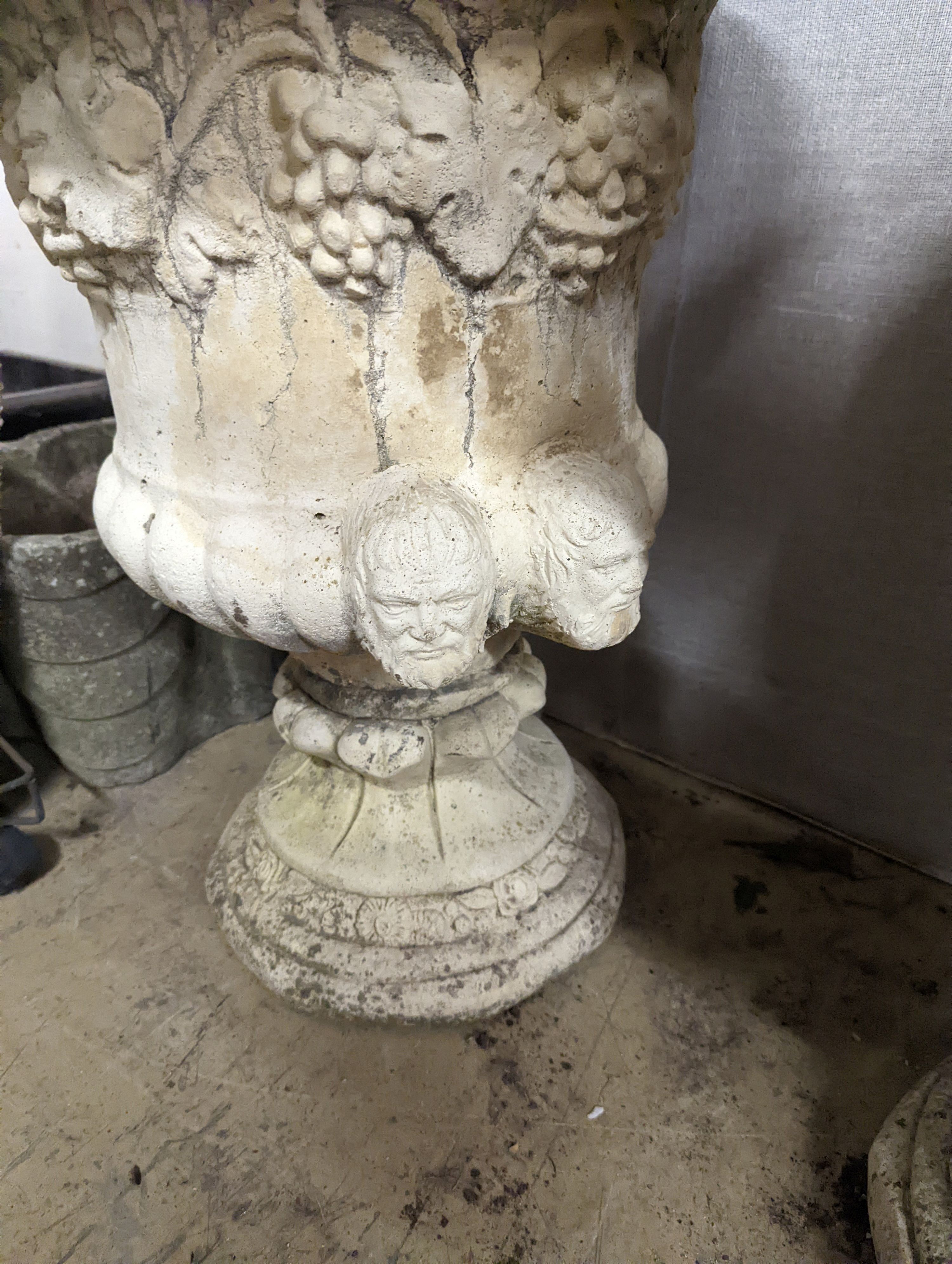A pair of reconstituted stone campana garden urns, diameter 54cm, height 64cm